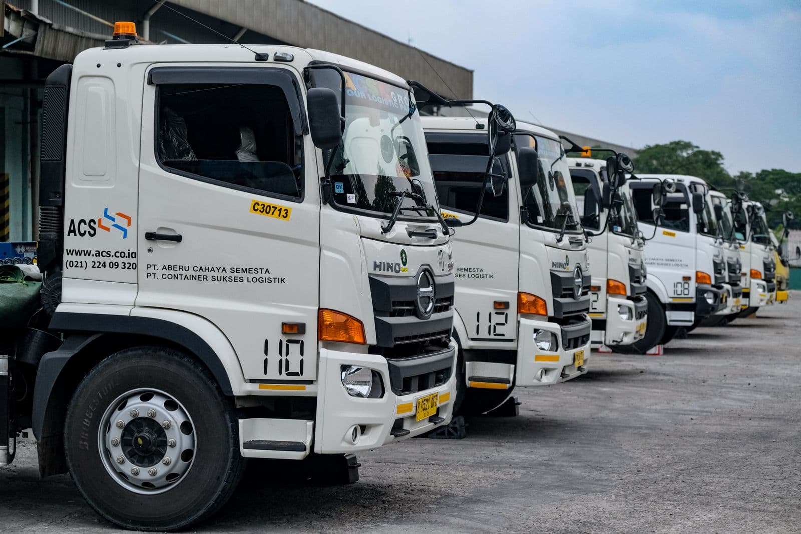 Multiple white trucks